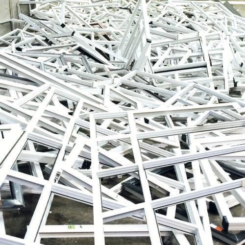 Pile of deglazed uPVC window frames