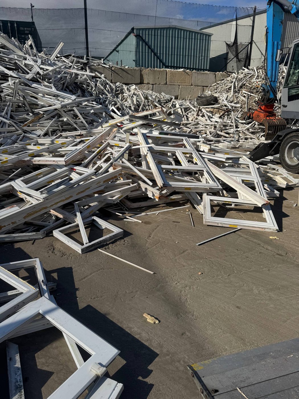 Large uPVC frame pile at the receiving yard